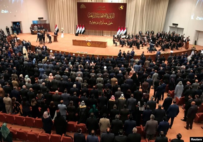 FILE PHOTO: Iraqi lawmakers are seen during the first session of the new Iraqi parliament in Baghdad, Sept. 3, 2018.