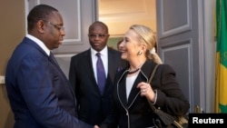 Hillary Clinton meets with Senegal's President Macky Sall at the Presidential Palace in Dakar August 1, 2012.