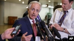 FILE - Senate Foreign Relations Committee Chairman Bob Corker, R-Tenn., shown talking to reporters after a briefing on talks with Iran in February, expects only a few votes on amendments to his Iran legislation.