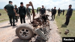Thai army soldiers search the area of a roadside bomb blast in the southern province of Pattani, June 19, 2017. 