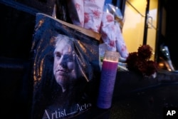 A makeshift memorial sits outside the home of actor Philip Seymour Hoffman, Feb. 3, 2014, in New York.