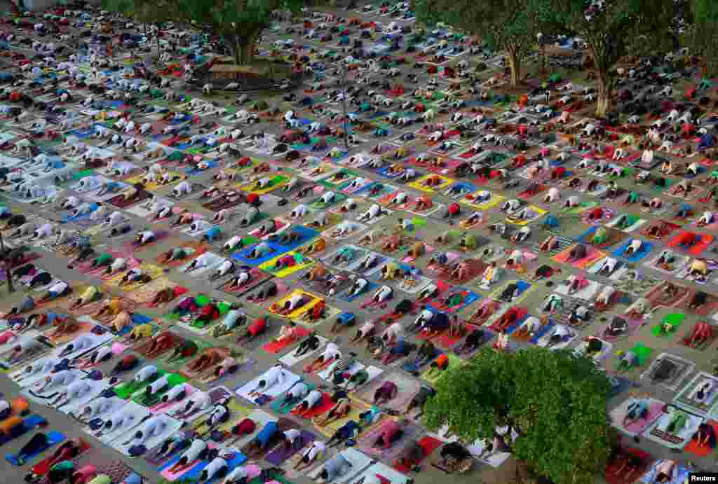 People perform yoga during a practice session ahead of International Yoga Day, in Chandigarh, India.