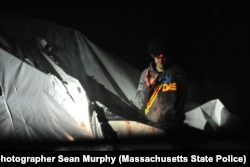 A sniper trains his bead on Tsarnaev.