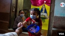 La tradición de la gritería se ha trasladado de generación en generación en Nicaragua. Foto Houston Castillo, VOA.