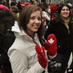Stephanie Tarasoff, wears a pair of commemorative red mittens worn by the Canadian National team in the Opening Ceremonies February 12
