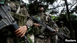 FILE - South Korean soldiers take part in an anti-terror drill in Seoul, Aug. 18, 2014.