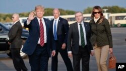 President Donald Trump and first lady Melania Trump on the tarmac during their arrival on Air Force One at Glasgow Prestwick Airport in Scotland, July 13, 2018.