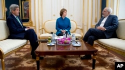 From left, U.S. Secretary of State John Kerry, European Union High Representative Catherine Ashton and Iranian Foreign Minister Mohammad Javad Zarif hold a trilateral meeting in Vienna, Austria, Oct. 15, 2014. 