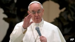 Pope Francis speaks during a meeting with the media at the Pope VI hall, at the Vatican, March 16, 2013.