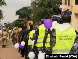 Ugandan police show solidarity with the U.N.'s #HeForShe campaign, Kampala, Uganda, Dec. 5, 2015.