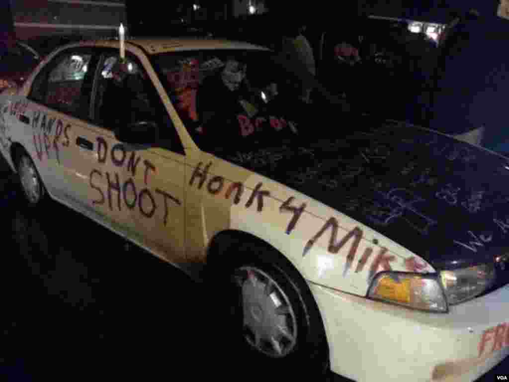 A reporter tweets this photo of a car bearing messages in support of Michael Brown, parked outside police headquarters in Ferguson, Missouri, Nov. 21, 2014.