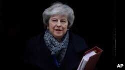 Prime Minister Theresa May leaves 10 Downing Street in London, Jan. 16, 2019. 