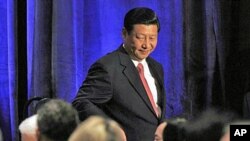 China's Vice President Xi Jinping leaves the stage after speaking to the US-China Business Council in Washington, February 15, 2012.