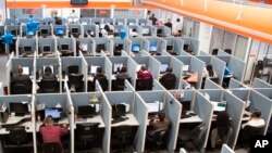 FILE - Workplaces have become high-stress spaces where many people feel overwhelmed.