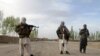 FILE - Members of the Taliban stand in Ghazni province.