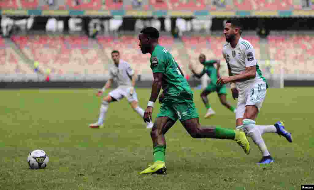 Sierra Leone&#39;s Kevin Wright in action against Algeria&#39;s Riyad Mahrez.