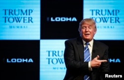 FILE - Donald Trump, pictured prior to his presidential run, speaks during a news conference to announce his first project in Mumbai, Aug. 12, 2014.