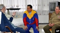 FILE - In this June 17, 2011 photo released by Granma newspaper, Cuba's former President Fidel Castro, left, and brother, Cuba's President Raul Castro, right, speak with Venezuela's President Hugo Chavez at a hospital as Chavez recuperates from surgery in