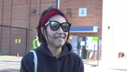 A Thai American first-time voter, Waranya Srisuta talks with VOA Thai at a polling station on Election Day in Springfield, VA, U.S., November 3, 2020.