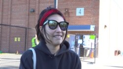 A Thai American first-time voter, Waranya Srisuta talks with VOA Thai at a polling station on Election Day in Springfield, VA, U.S., November 3, 2020.