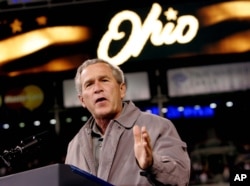 FILE - President George W. Bush speaks at a campaign rally at the Great American Ball Park in Cincinnati.