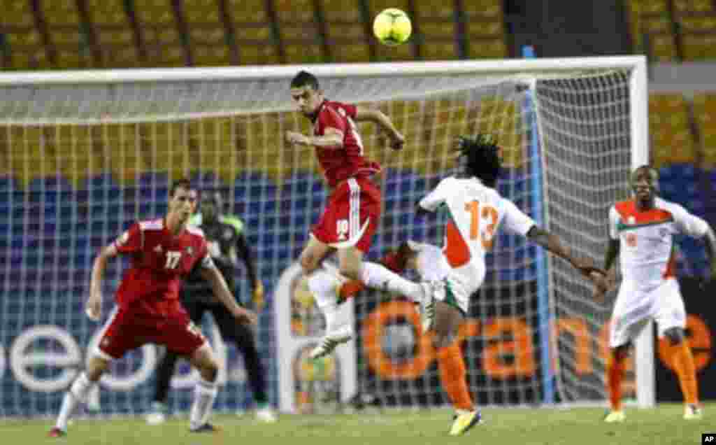 Morocco's Younes Belhanda (10) jumps for the ball against Niger players during their final African Cup of Nations Group C soccer match at the Stade De L'Amitie Stadium in Libreville, Gabon January 31, 2012.