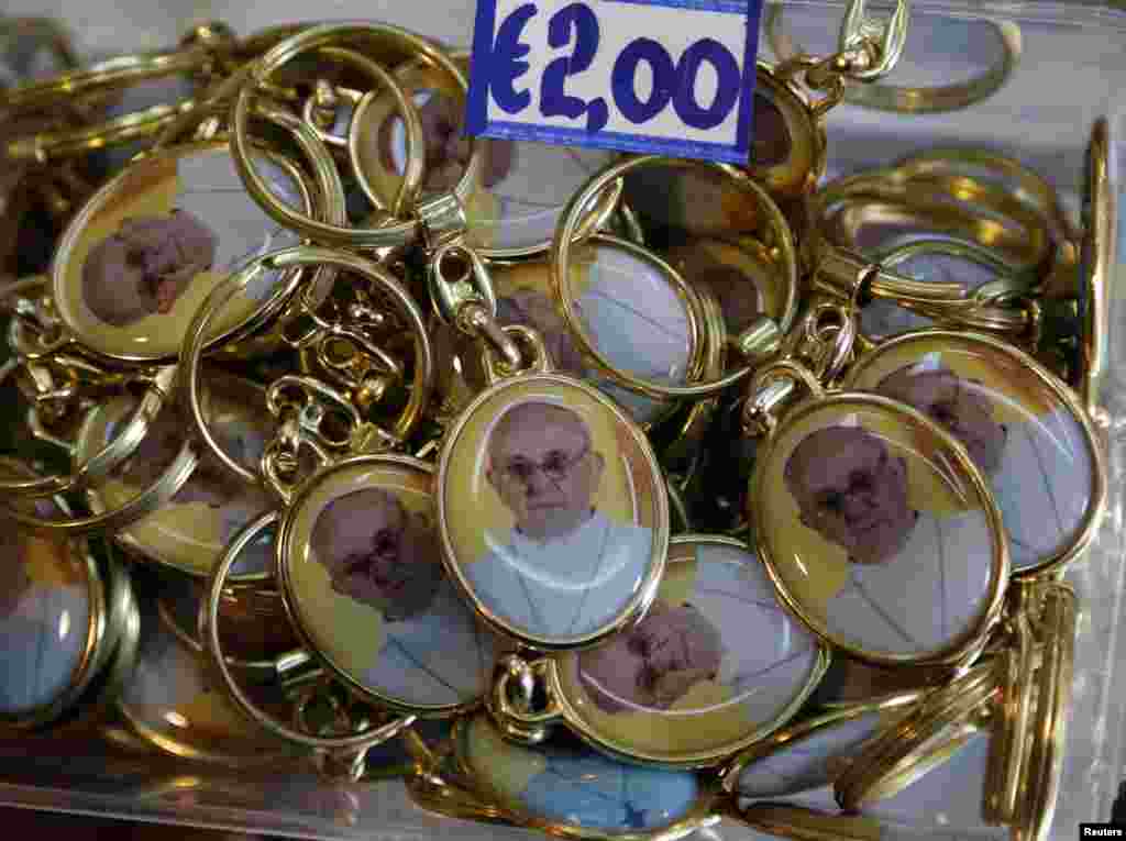 Key chains featuring images of the newly-elected Pope Francis are displayed in a tourist shop near the Vatican in Rome, March 15, 2013.
