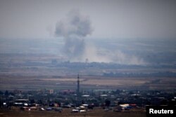 Smoke following the explosions in Syria is seen from the Israeli-occupied Golan Heights near the Israeli Syrian border, July 19, 2018.