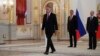 U.S. Ambassador Jon Huntsman walks after presenting credentials to Russian President Vladimir Putin, right, during a ceremony in the Kremlin in Moscow, Russia, on Tuesday, Oct. 3, 2017. 