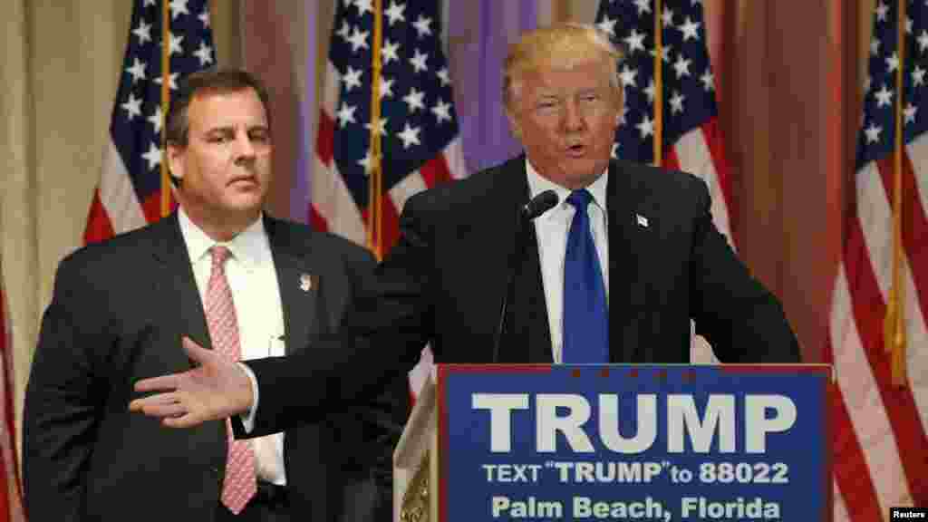 Republican U.S. presidential candidate Donald Trump, with former rival candidate Governor Chris Christie, left, at his side, speaks at a news conference in Palm Beach, Fla., March 1, 2016. 