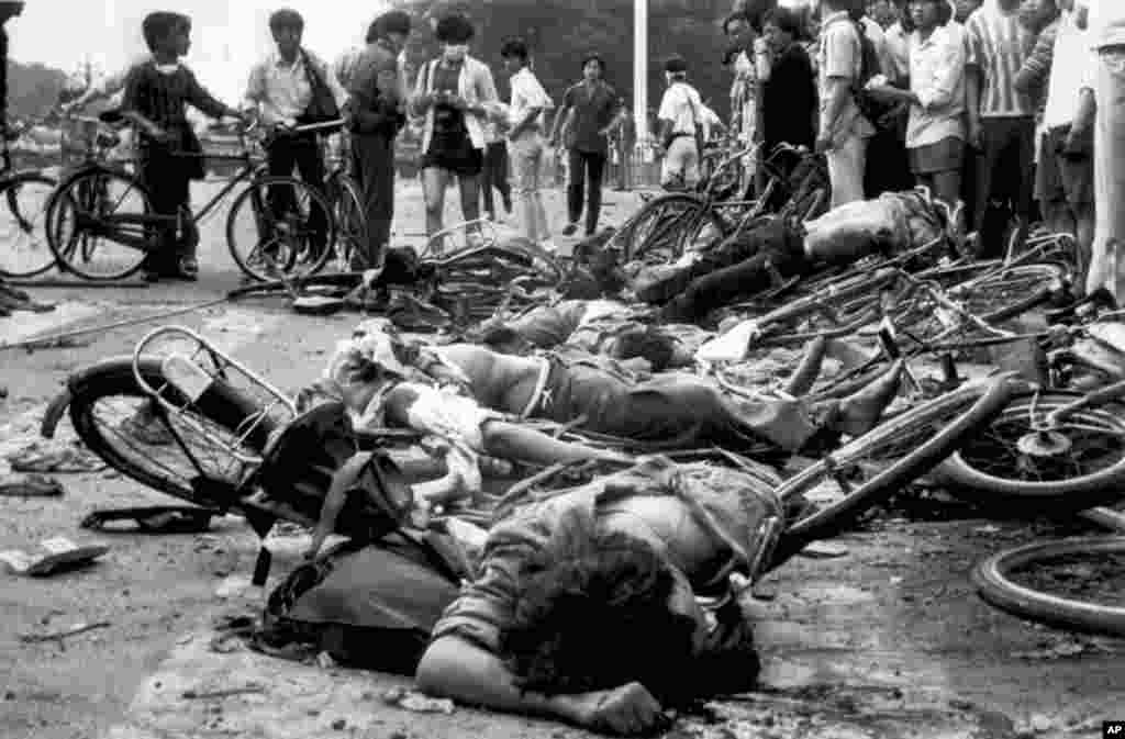 Bodies lie among mangled bicycles near Beijing's Tiananmen Square in this June 4, 1989 file photo.