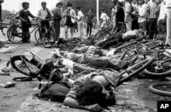 Bodies lie among mangled bicycles near Beijing's Tiananmen Square in this June 4, 1989 file photo.