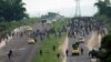 Congolese police chase supporters of opposition candidate Martin Fayulu who were marching towards Nsele, 50kms east of Kinshasa, Democratic Republic of the Congo, Dec. 19, 2018. 
