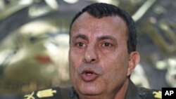 General Ismail Etman, director of moral affairs and a member of the Supreme Council of the Armed Forces, speaks during a news conference at the military media centre in Cairo, March 28, 2011