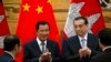 Cambodian Prime Minister Hun Sen, center left, applauds with Chinese Premier Li Keqiang during a signing ceremony at the Great Hall of the People in Beijing, China, Tuesday, Jan. 22, 2019. 