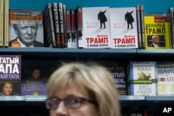 Books by and about Donald Trump, U.S. president-elect at the time, are on display in the Moscow House of Books store in Moscow, Russia, Nov. 14, 2016. Trump's books and literature about him have been at high demand at Moscow book stores following his victory in the U.S. presidential elections, according to the bookstore.