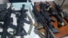 Some of the weapons seized by Haiti's national police force officers (PNH) Sunday after arresting 8 men who are charged with "conspiracy". 