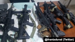 Some of the weapons seized by Haiti's national police force officers (PNH) Sunday after arresting 8 men who are charged with "conspiracy". 