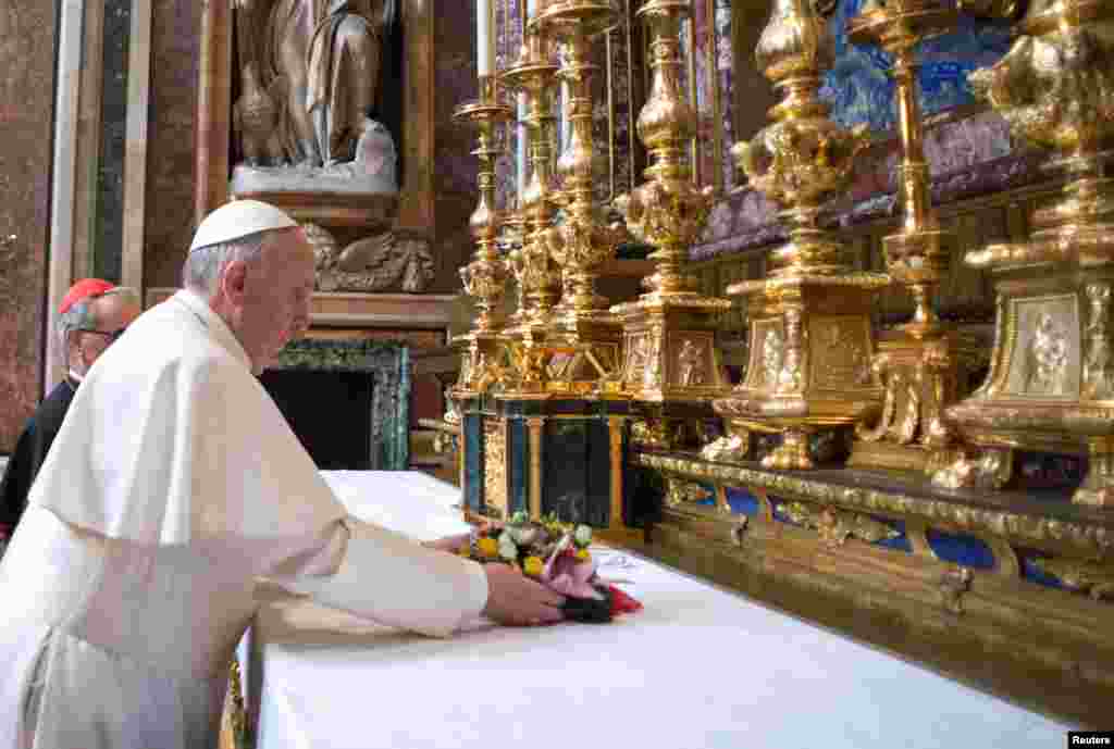 Newly elected Pope Francis makes a private visit to the 5th-century Basilica of Santa Maria Maggiore, in a photo released by Osservatore Romano in Rome, March 14, 2013.