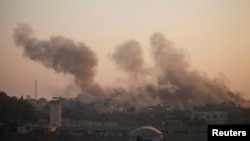 Smoke rises after explosion at smuggling tunnel dug beneath Gaza-Egypt border, southern Gaza Strip, Aug. 31, 2013.