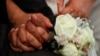 สหรัฐฯ รวบ 50 คน เอี่ยวขบวนการ “รับจ้างแต่งงาน”