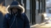 A commuter arrives at Metra Western Avenue station, in Chicago, Illinois, Jan. 29, 2019, as extreme cold and record-breaking temperatures are moving into the region.