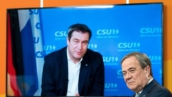 FILE PHOTO: Christian Social Union (CSU) Bavarian State Prime Minister Markus Soeder is seen on a screen as he speaks to Christian Democratic Union (CDU) North Rhine Westphalia (NRW) State Prime Minister Armin Laschet during a virtual CDU new year recepti