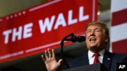 FILE - President Donald Trump speaks during a rally in El Paso, Texas, Feb. 11, 2019.