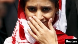 Geeta comes out from an airport after her arrival in New Delhi, India, Oct. 26, 2015. The deaf-mute Indian girl stranded in Pakistan for 13 years after wandering over one of the world's most militarized borders arrived home to be reunited with the family she has identified from photographs. 