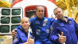 Crew members, cosmonaut Anton Shkaplerov, actress Yulia Peresild and film director Klim Shipenko.