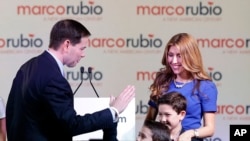 After announcing his 2016 presidential bid, Senator Marco Rubio of Florida high fives son Dominic as wife Jeanette and son Anthony watch in Miami, April 13, 2015.