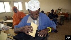 A Djiboutian casts his vote for president in Djibouti, East Africa, Friday, April 8, 2011.