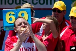 Joey Chestnut competes in Nathan's Famous Fourth of July International Hot Dog Eating Contest men's competition in New York, July 4, 2016.