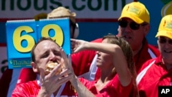 Joey Chestnut competes in Nathan's Famous Fourth of July International Hot Dog Eating Contest men's competition in New York, July 4, 2016.